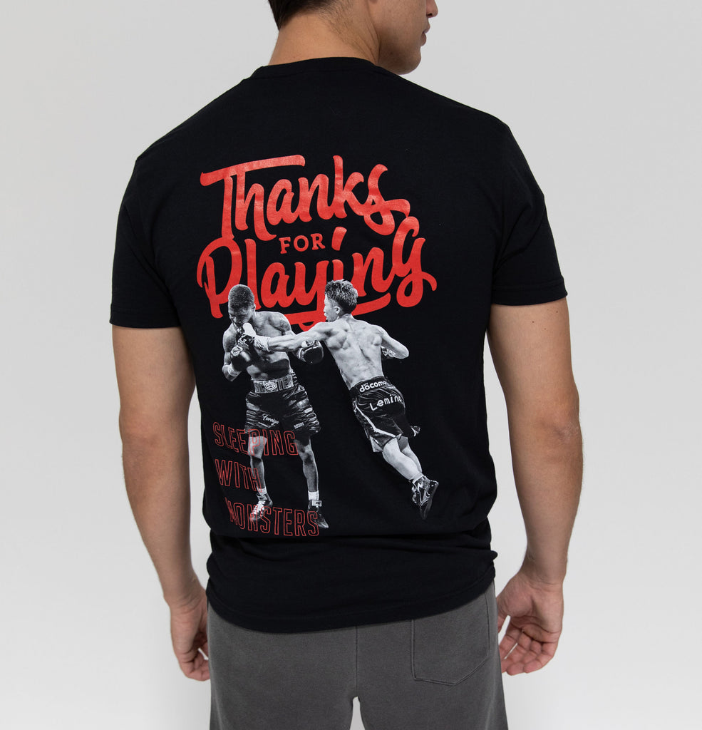 The back side of the black Sleeping with Monsters Fight shirt.